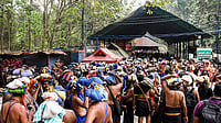 | Photo: PTI : Devotees carry ‘Irumudi’ during the 'Vrischikam' after the Sabarimala temple opened for 'Mandala-Makaravilakku' pilgrimage season, in Pathanamthitta.
