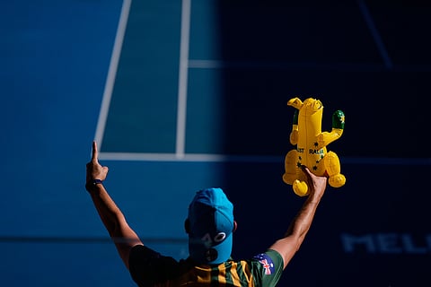 A supporter of Dane Sweeny of Australia reacts during his first round match against Gael Monfils of France at the Australian Open tennis championship in Melbourne, Australia.