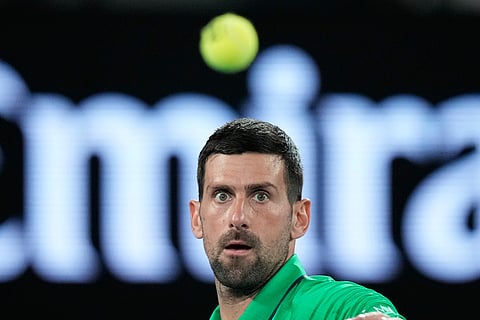 Novak Djokovic of Serbia plays a forehand return to during his first round match against Pedro Martinez of Spain at the Australian Open tennis championship in Melbourne, Australia.