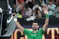 | Photo: AP/Aaron Favila : Novak Djokovic of Serbia celebrates after defeating Pedro Martinez of Spain in their first round match at the Australian Open tennis championship in Melbourne, Australia.