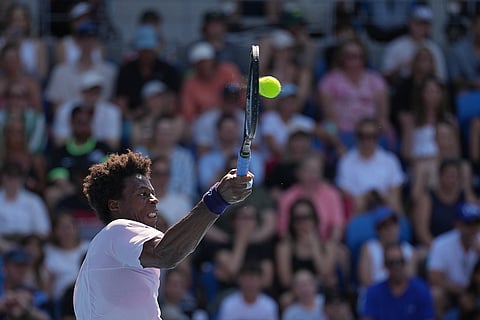 Gael Monfils of France plays a forehand return to Dane Sweeny of Australia during their first round match at the Australian Open tennis championship in Melbourne, Australia.