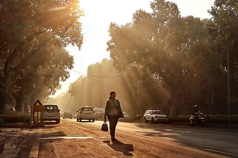 Commuters make their way during a smoggy winter morning, in New Delhi. Delhi's three-day run of 'severe' air pollution ended on Tuesday morning, with the city's average Air Quality Index (AQI) showing a marginal improvement and settling in the 'very poor' category at 395. 