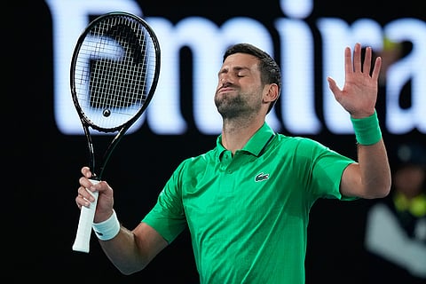Novak Djokovic of Serbia reacts during his first round match against Pedro Martinez of Spain at the Australian Open tennis championship in Melbourne, Australia.