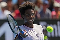 Gael Monfils Loses To Home Favourite Dane Sweeny, Bids Emotional Goodbye | Photo: AP/Dita Alangkara : Gael Monfils of France plays a forehand return to Dane Sweeny of Australia during their first round match at the Australian Open tennis championship in Melbourne, Australia.
