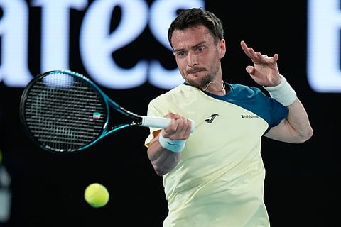 Pedro Martinez of Spain plays a forehand return to Novak Djokovic of Serbia during their first round match at the Australian Open tennis championship in Melbourne, Australia.