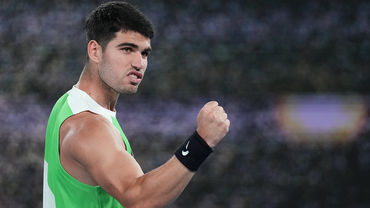 Carlos Alcaraz of Spain celebrates after defeating Adam Walton of Australia in their first round match at the Australian Open. - AP/Dita Alangkara