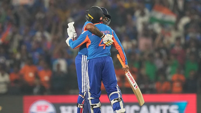 India's captain Suryakumar Yadav, left, hugs to congratulate batting partner Abhishek Sharma on scoring fifty runs during the first T20 cricket match between India and New Zealand in Nagpur, India, Wednesday, Jan. 21, 2026. - (AP Photo/Mahesh Kumar A.)