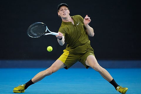 Jannik Sinner of Italy plays a forehand return to Hugo Gaston of France during their first round match at the Australian Open tennis championship in Melbourne, Australia.