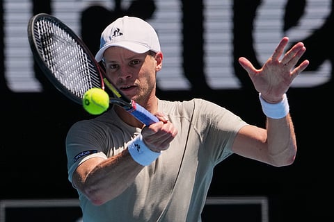 Yannick Hanfmann of Germany plays a forehand return to Carlos Alcaraz of Spain during their second round match at the Australian Open tennis championship in Melbourne, Australia.