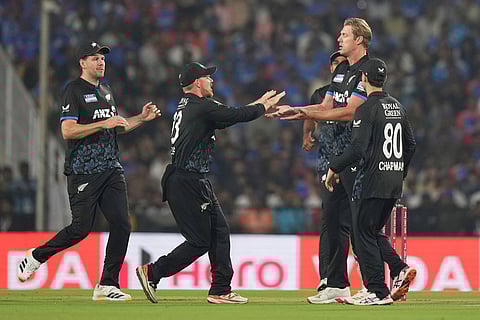 New Zealand's Kyle Jamieson, second right, celebrates with teammates after the dismissal of India's Sanju Samson during the first T20 cricket match between India and New Zealand in Nagpur, India.