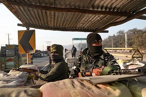 Security personnel maintain vigilance along the Jammu & Kashmir National Highway ahead of Republic Day, conducting vehicle checks and random frisking to ensure a secure environment, in Jammu.