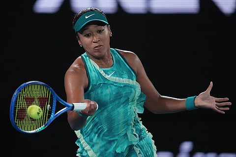 Naomi Osaka of Japan plays a forehand return to Antonia Ruzic of Croatia during their first round match at the Australian Open tennis championship in Melbourne, Australia.