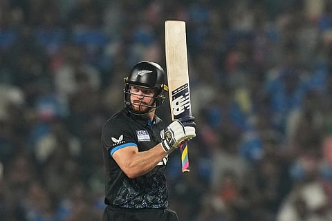 New Zealand's Glenn Phillips celebrates after scoring fifty runs during the first T20 cricket match between India and New Zealand in Nagpur, India.