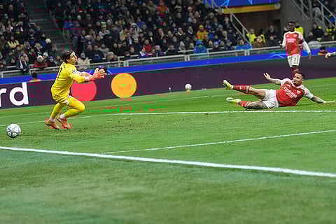 Arsenal's Gabriel Jesus scores his side's opening goal during the Champions League opening phase soccer match between Inter Milan and Arsenal in Milan, Italy.