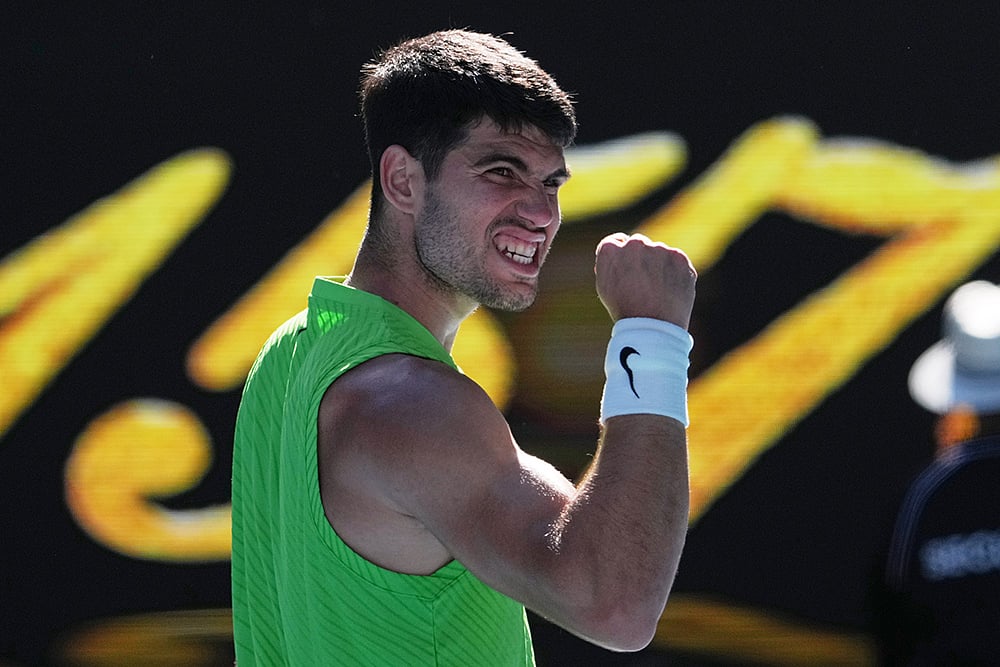 Carlos Alcaraz of Spain celebrates after defeating Yannick Hanfmann of Germany in their second round match at the Australian Open tennis championship in Melbourne, Australia. - | Photo: AP/Dita Alangkara