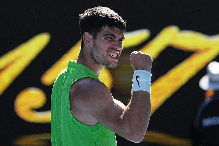 Carlos Alcaraz of Spain celebrates after defeating Yannick Hanfmann of Germany in their second round match at the Australian Open tennis championship in Melbourne, Australia. - | Photo: AP/Dita Alangkara