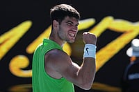| Photo: AP/Dita Alangkara : Carlos Alcaraz of Spain celebrates after defeating Yannick Hanfmann of Germany in their second round match at the Australian Open tennis championship in Melbourne, Australia.