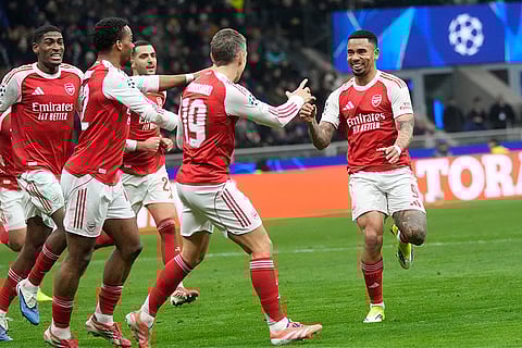 Arsenal's Gabriel Jesus, right, celebrates with his teammates after scoring his side's second goal during the Champions League opening phase soccer match between Inter Milan and Arsenal in Milan, Italy.