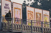 | Photo: PTI/Kamal Kishore : A police official stands guard near standees during rehearsals for the Republic Day Parade on a cold winter morning, in New Delhi. The sesquicentenary of 'Vande Mataram' will be the dominant theme of this year's parade, with enclosure backdrops along the Kartavya Path displaying old paintings illustrating the opening stanzas of the National Song and floral artworks at the main stage paying homage to its composer Bankim Chandra Chatterjee. 
