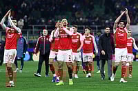 | Photo: Fabrizio Carabelli/PA via AP : Arsenal's William Saliba (center), Mikel Merino (left), Declan Rice and team-mates applaud the fans after the UEFA Champions League match at the San Siro, Milan.