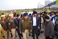 PTI : Police officials during a search operation at the site after a 27-year-old software engineer died, whose car had plunged into a water-filled pit at a construction site, in Noida, Tuesday, Jan. 20, 2026. Abhay Kumar, director of MZ Wiztown Planners and one of the accused in the case, was arrested on Tuesday. 