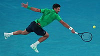 | Photo: AP/Aaron Favila : Novak Djokovic of Serbia plays a backhand return to Pedro Martinez of Spain during their first round match at the Australian Open tennis championship in Melbourne, Australia, Monday, Jan. 19, 2026.