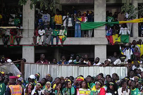 Fans celebrate the Senegalese soccer team's victory in the Africa Cup of Nations soccer tournament, in Dakar, Senegal.