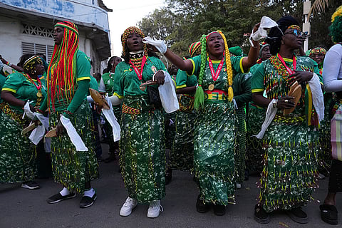 Fans celebrate the Senegalese soccer team's victory in the Africa Cup of Nations soccer tournament, in Dakar, Senegal.