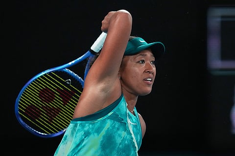 Naomi Osaka of Japan plays a forehand return to Antonia Ruzic of Croatia during their first round match at the Australian Open tennis championship in Melbourne, Australia.