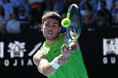 Carlos Alcaraz of Spain plays a backhand return to Yannick Hanfmann of Germany during their second round match at the Australian Open tennis championship in Melbourne, Australia.