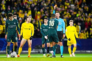 | Photo: Fredrik Varfjell/NTB via AP : Manchester City's Rodri is shown a red card by referee Sven Jablonski during the Champions League soccer match between Bodo/Glimt and Manchester City in Bodo, Norway.