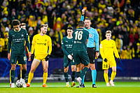 | Photo: Fredrik Varfjell/NTB via AP : Manchester City's Rodri is shown a red card by referee Sven Jablonski during the Champions League soccer match between Bodo/Glimt and Manchester City in Bodo, Norway.