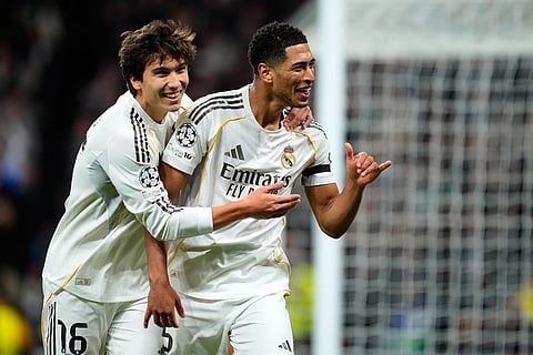 Real Madrid's Jude Bellingham celebrates his side's sixth goal during the Champions League opening phase soccer match between Real Madrid and Monaco in Madrid.