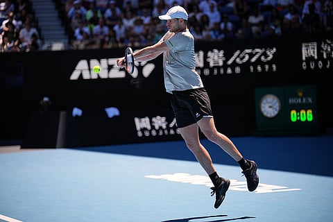 Yannick Hanfmann of Germany plays a backhand return to Carlos Alcaraz of Spain during their second round match at the Australian Open tennis championship in Melbourne, Australia.