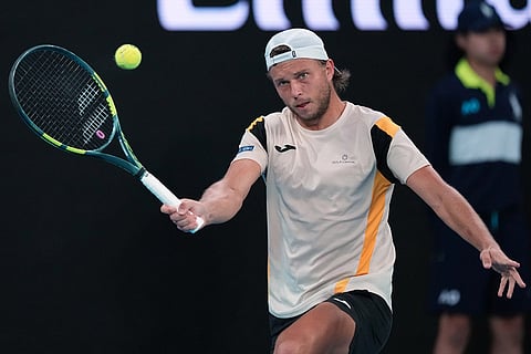 Alexandre Muller of France plays a forehand return to Alexander Zverev of Germany during their second round match at the Australian Open tennis championship in Melbourne, Australia.