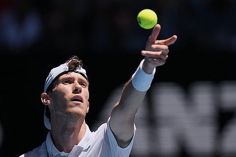 Francesco Maestrelli of Italy serves to Novak Djokovic of Serbia during their second round match at the Australian Open tennis championship in Melbourne, Australia.