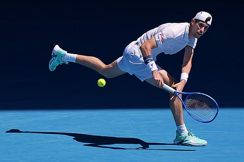 Francesco Maestrelli of Italy plays a backhand return to Novak Djokovic of Serbia during their second round match at the Australian Open tennis championship in Melbourne, Australia.