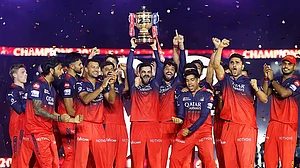 File : Virat Kohli lifts the trophy as RCB celebrate their maiden IPL title.