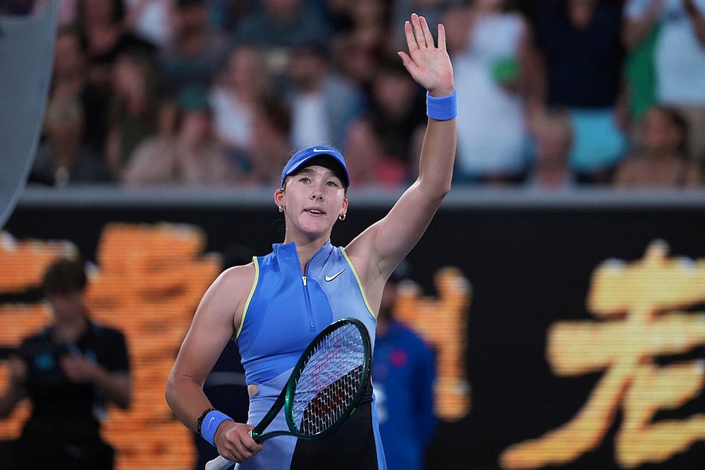 Mirra Andreeva of Russia waves after defeating Maria Sakkari of Greece in their second round match at the Australian Open tennis championship in Melbourne, Australia. - | Photo: AP/Asanka Brendon Ratnayake