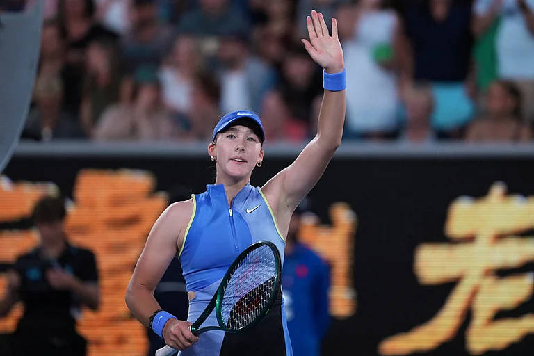 Mirra Andreeva of Russia waves after defeating Maria Sakkari of Greece in their second round match at the Australian Open tennis championship in Melbourne, Australia. - | Photo: AP/Asanka Brendon Ratnayake