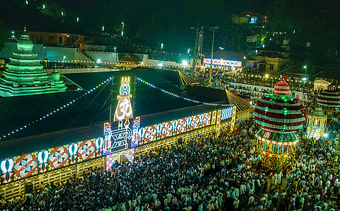 Devotees gather during a religious procession at the Kadri Manjunatha Temple, in Mangaluru.