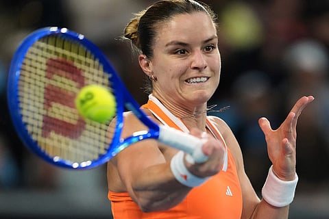 Maria Sakkari of Greece plays a forehand return to Mirra Andreeva of Russia during their second round match at the Australian Open tennis championship in Melbourne, Australia.