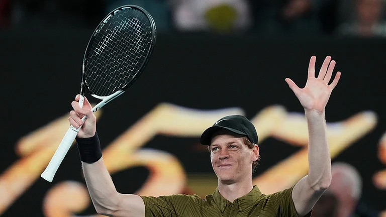 Jannik Sinner of Italy waves after winning his second round match against James Duckworth of Australia at the Australian Open tennis championship in Melbourne. - Photo: AP