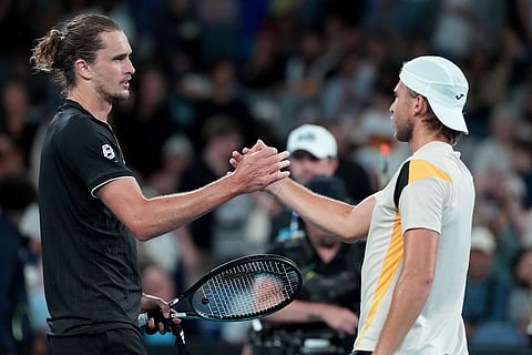 Alexander Zverev, left, of Germany is congratulated by Alexandre Muller of France following their second round match at the Australian Open tennis championship in Melbourne, Australia.