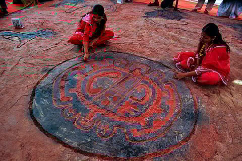 Students display replicas of 20,000-year-old rock art from the Konkan region during an exhibition organised to create awareness about early human heritage, at Thane College campus.