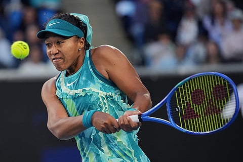 Naomi Osaka of Japan plays a backhand return to Sorana Cirstea of Romania during their second round match at the Australian Open tennis championship in Melbourne, Australia.