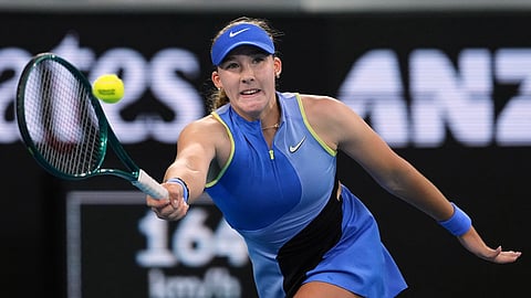 Mirra Andreeva of Russia plays a forehand return to Maria Sakkari of Greece during their second round match at the Australian Open tennis championship in Melbourne, Australia.