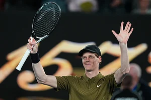 | Photo: AP/Aaron Favila : Jannik Sinner of Italy waves after winning his second round match against James Duckworth of Australia at the Australian Open tennis championship in Melbourne, Australia.