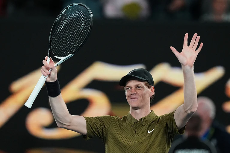 Jannik Sinner of Italy waves after winning his second round match against James Duckworth of Australia at the Australian Open tennis championship in Melbourne, Australia. - | Photo: AP/Aaron Favila