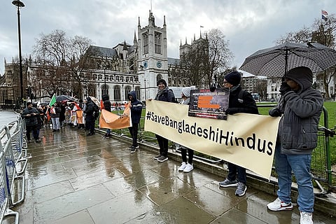 British Hindus and Bangladeshi diaspora groups hold banners during a protest against the persecution of minorities in Bangladesh, calling on the British government to ensure the Mohammad Yunus-led interim government acts to protect innocent lives, in London.
